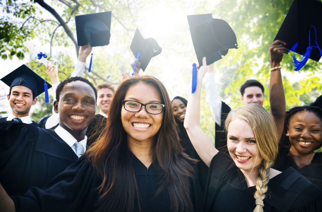 Group of students celebrate graduation from university