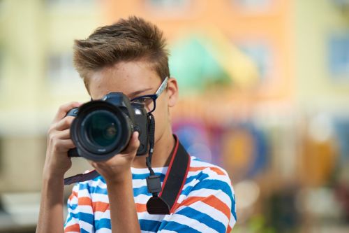 A young teen taking photos to sell on the internet