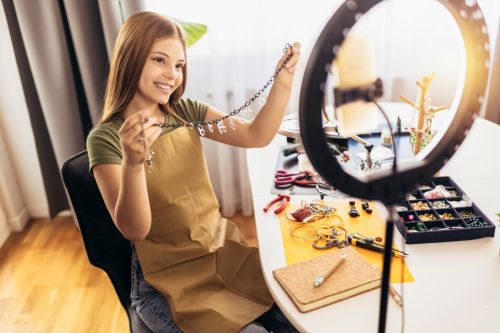 A teen girl making jewellery to sell online