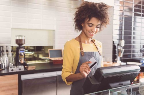 A teenager working as a barista at a cafe