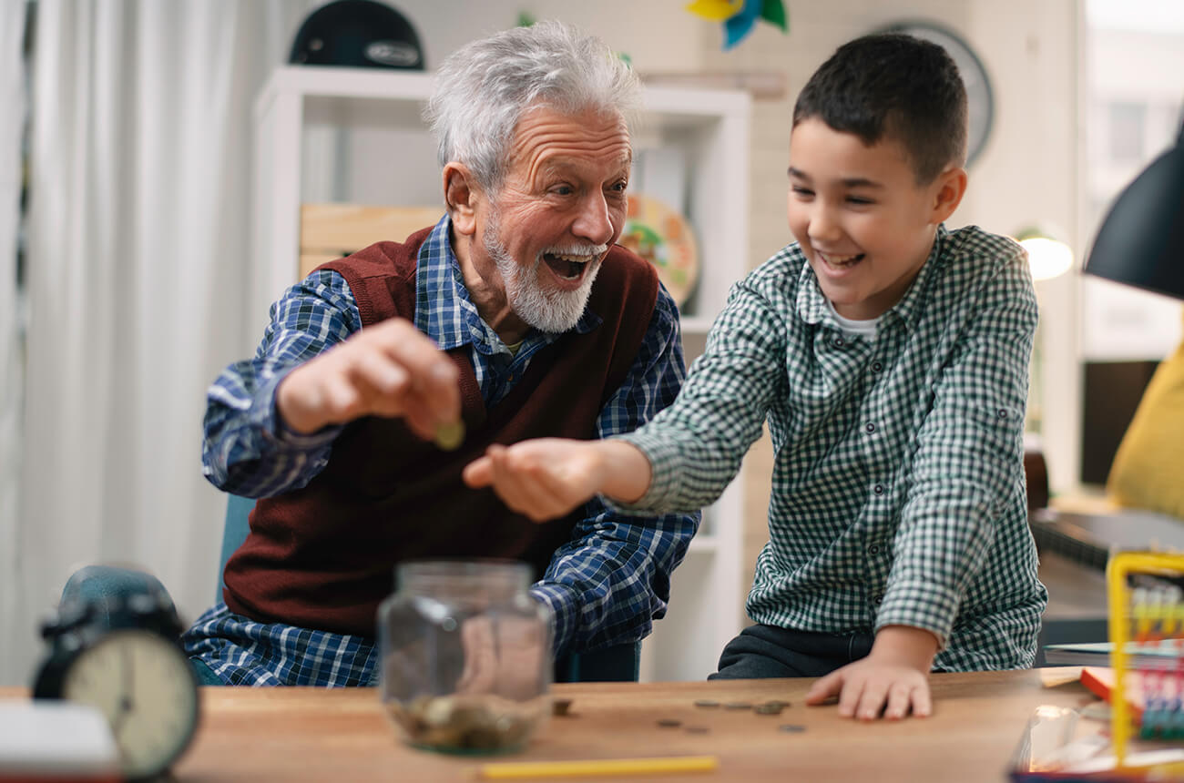 A grandpa giving his grandson an allowance