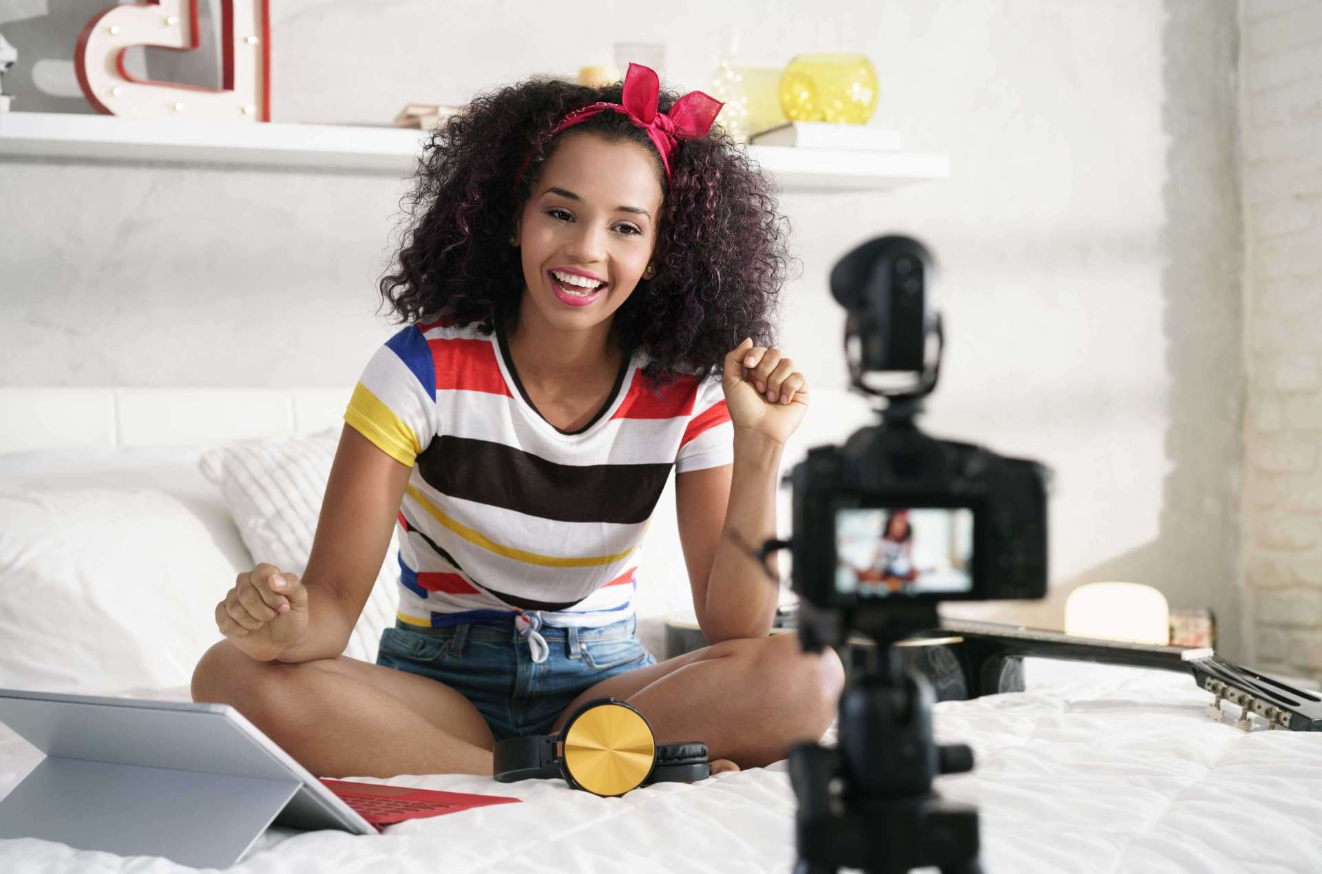 A girl recording a video and using a tablet
