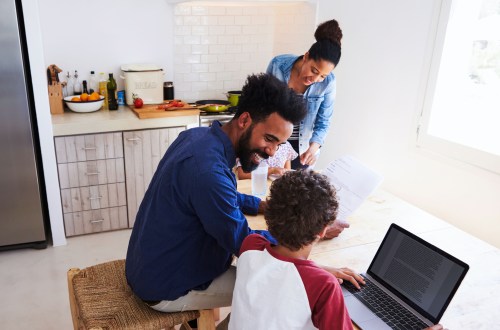 family talking in kitchen