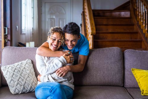 Teen boy hugging mom