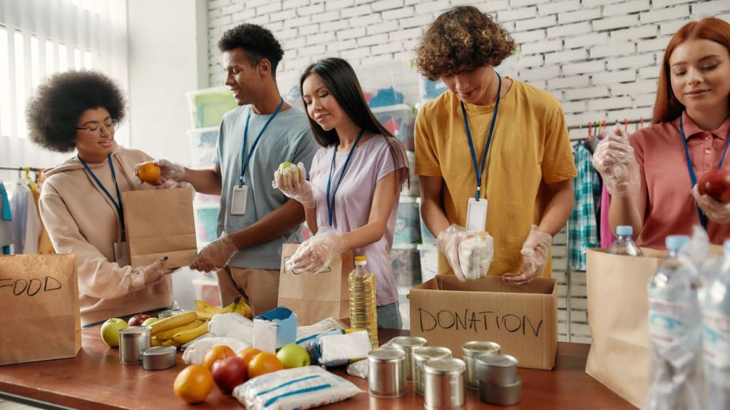 A group of teenagers taking a gap year to volunteer and work at a food bank
