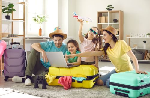 Family packs suitcases for vacation