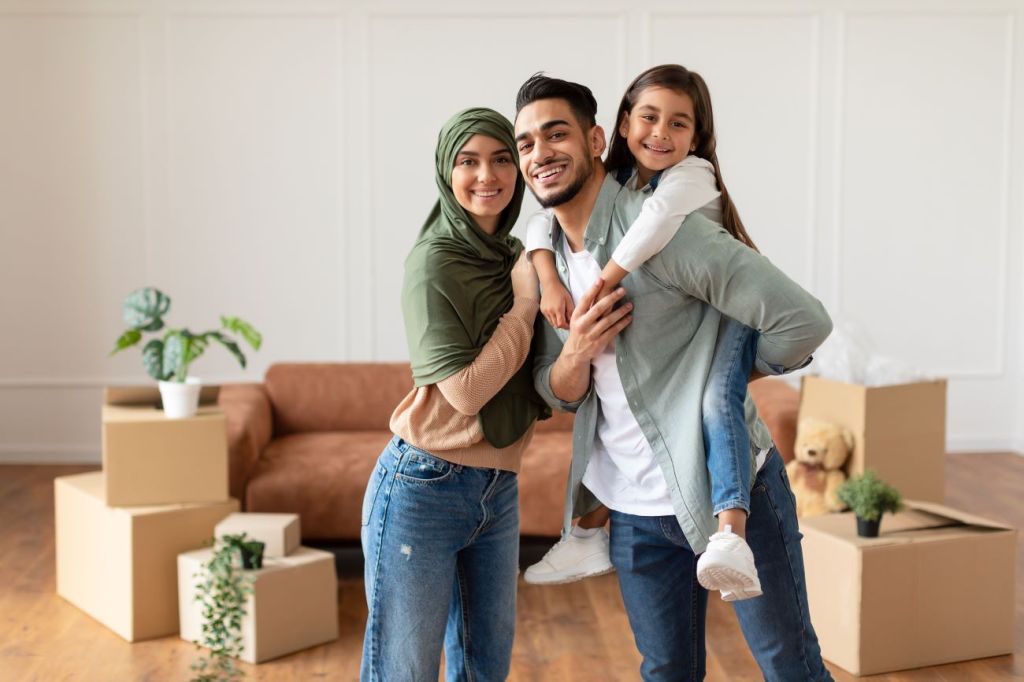 A young couple and kids protected by insurance