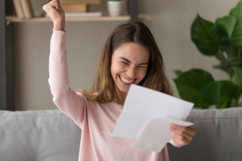 Teen girl celebrates seeing her deductions on tax return