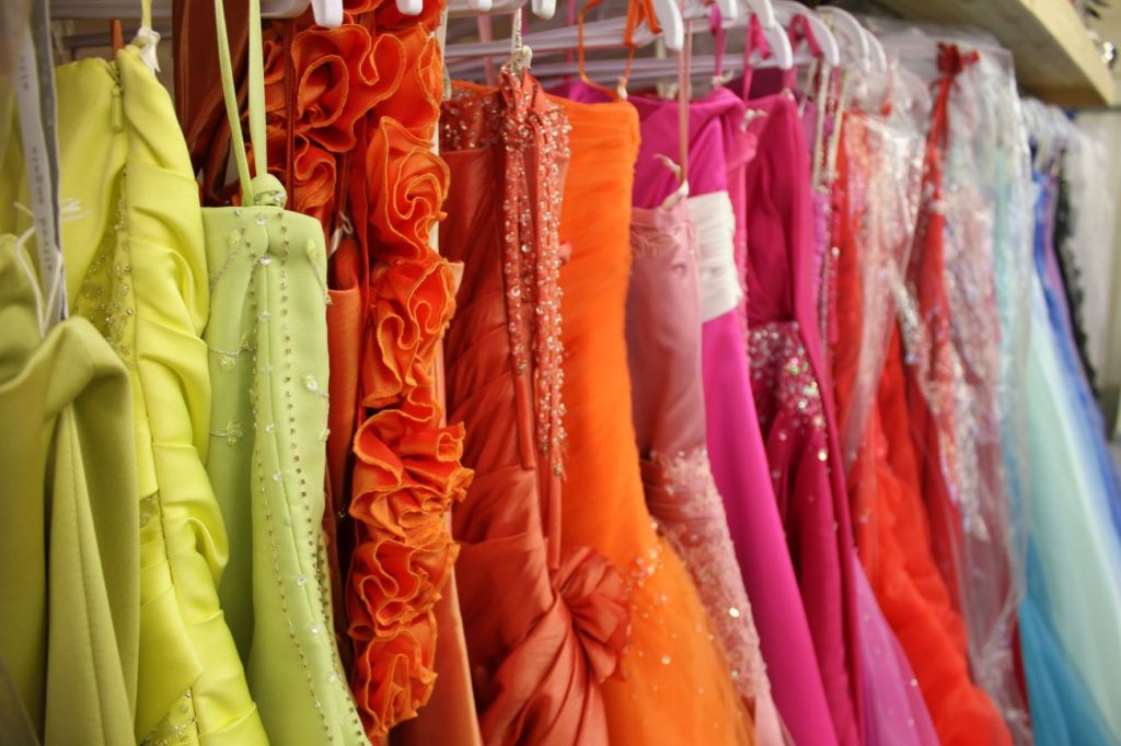 Row of colourful prom dresses