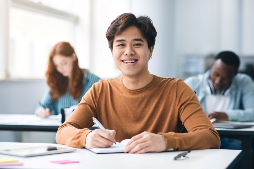 A teenager in a school classroom