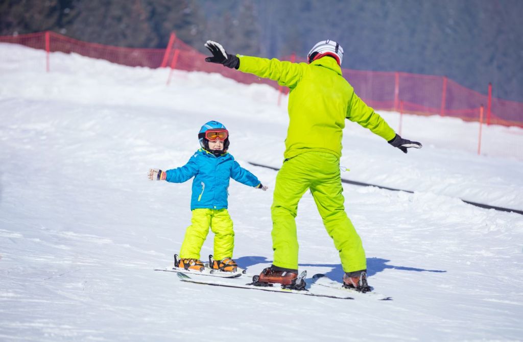 An older teenager working as a part-time ski instructor 