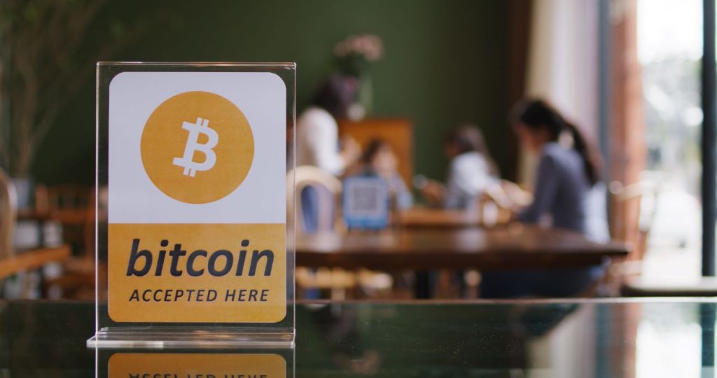 Bitcoin accepted here sign at cafe