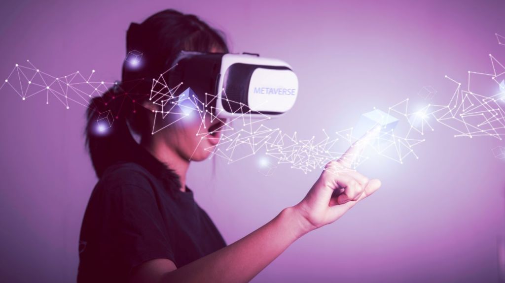 Teen girl wearing VR goggles playing in the metaverse