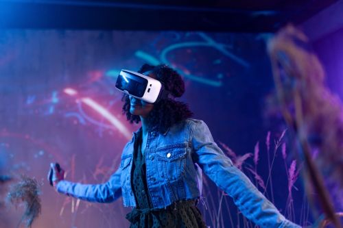Teen girl wearing VR headset exploring the metaverse
