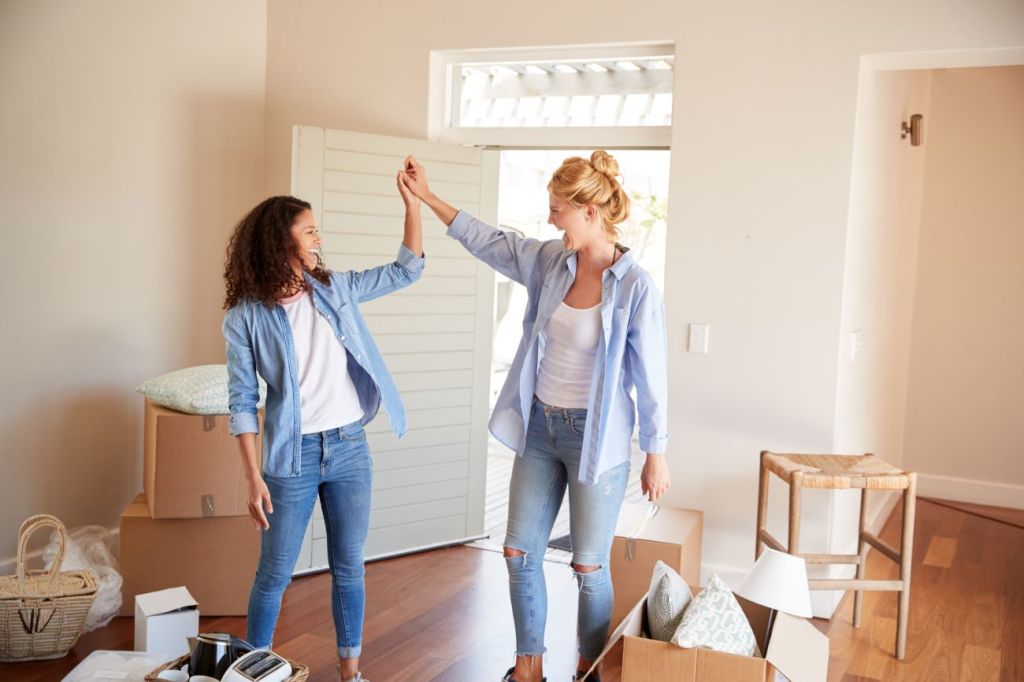 A mom helping her teen daughter move into a new home she purchased through the home buyers' plan.