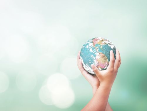 child holding globe of earth