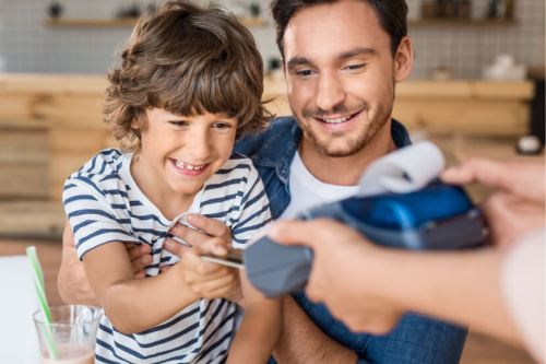 Kid and dad using Mydoh card