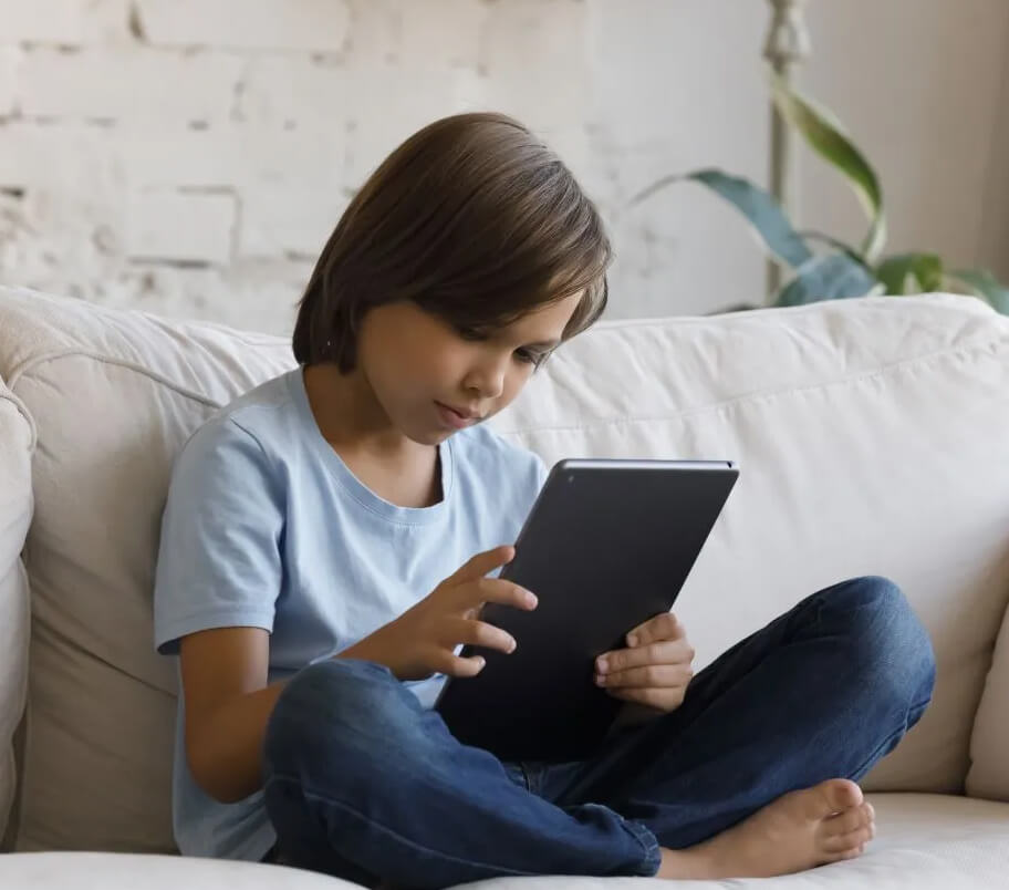Boy sitting with tablet