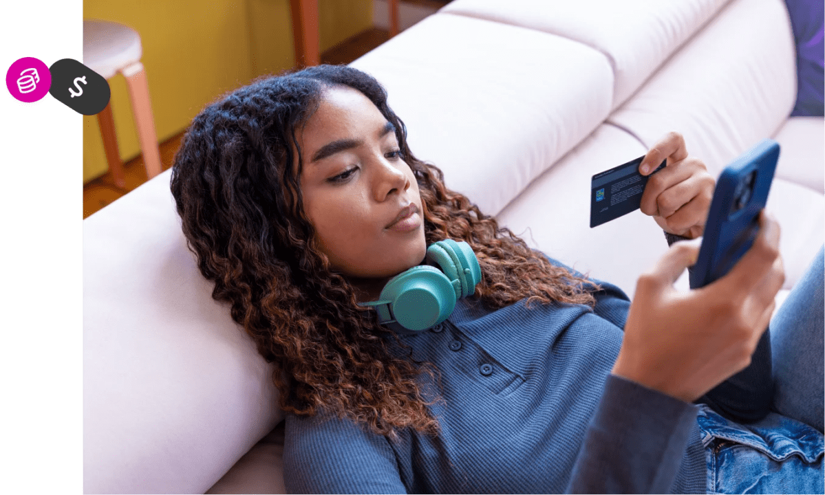 See how it works: a person relaxes on a sofa, holding a smartphone and payment card while shopping online, with coin and dollar icons overlay.