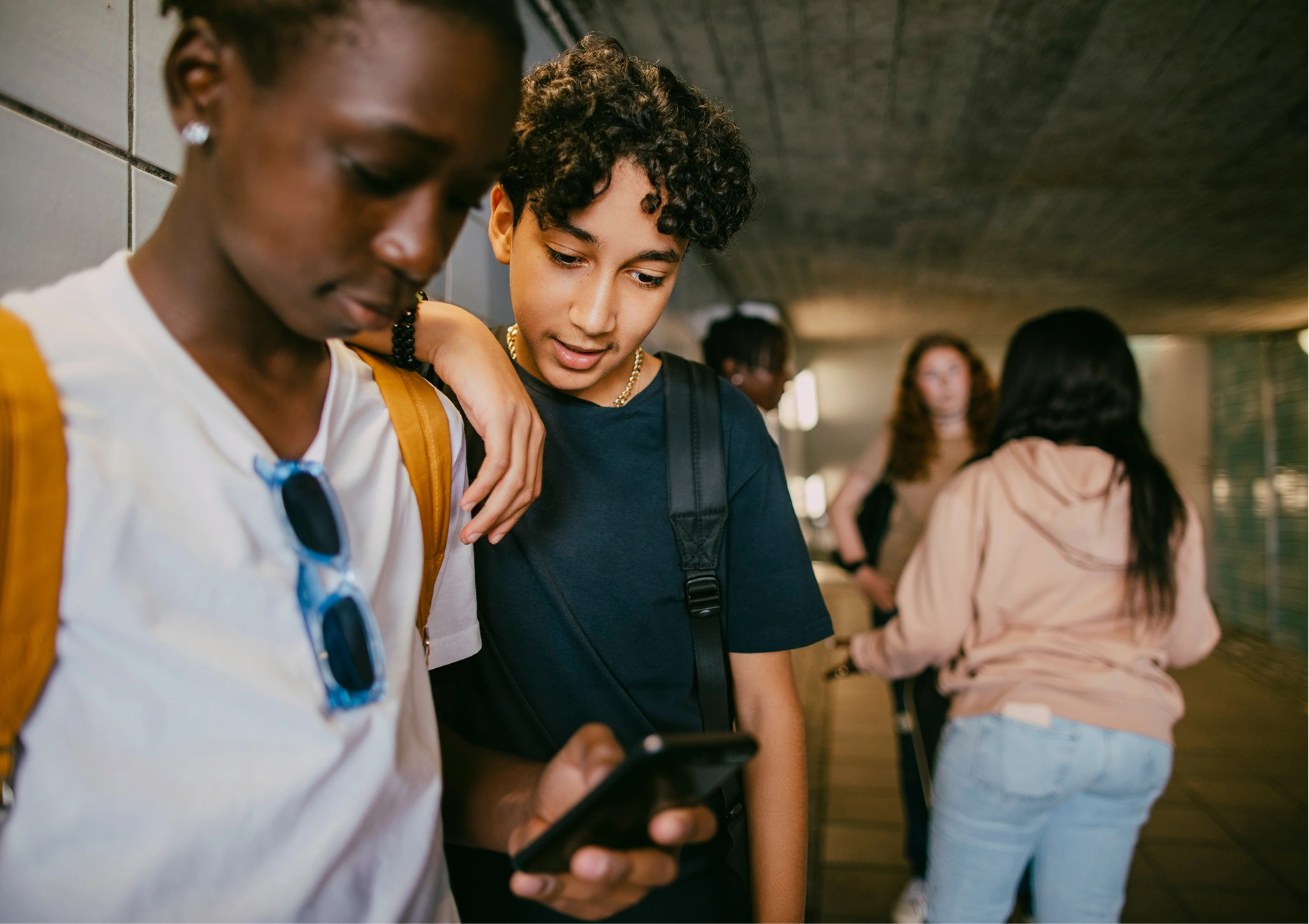 Students walking through a school hallway